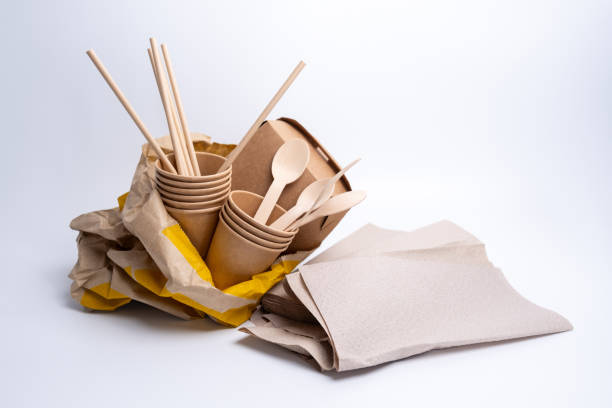 istock Kraft paper tableware: cups, food boxes, isolated on a light background. A set of various disposable tableware. Recycling and zero waste concept. Mock up 2156207702