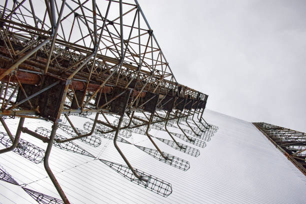 istock Rusted frameworks under a grey sky, entwined in dense wiring. Duga is a Soviet over-the-horizon radar station for an early detection system for ICBM launches. 2156211956