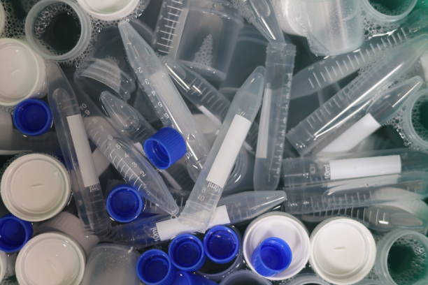 istock Many test tubes with blue and white caps in water during washing 2156217843