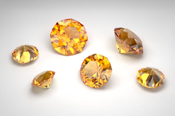 Scattering of topazes of different sizes on the white background. Cut in brilliant style. 3d rendering. stock photo