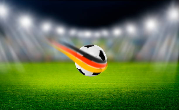 istock Soccer ball with German flag in the stadium 2156219326