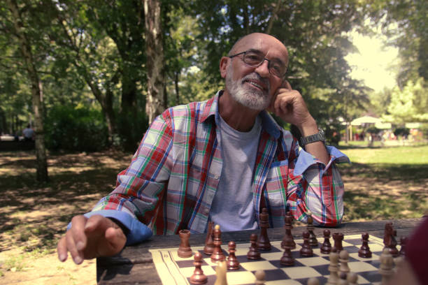 public park chess sport thinking fun master pensioners glasses