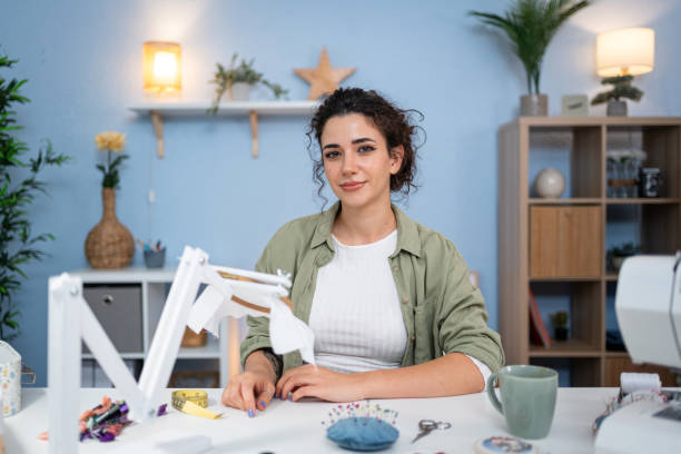 istock Portrait of creative designer preparing fabric for hand embroidery 2156220042