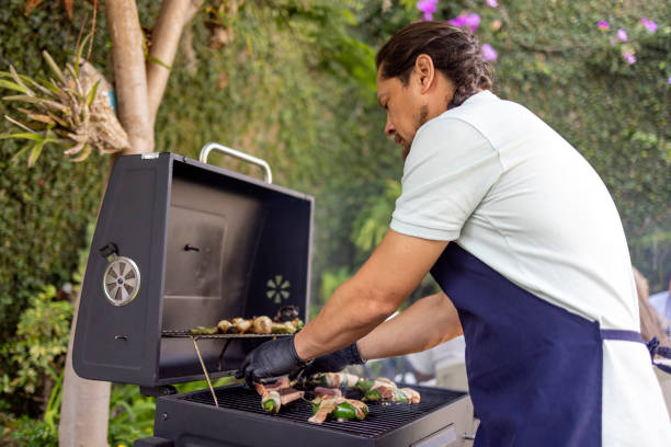 istock Man choosing and seasoning the meat 2156220613