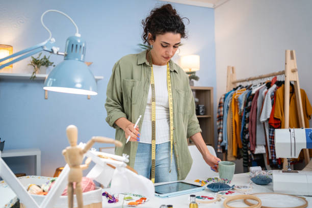 istock A young woman works on new projects in a design studio 2156220671