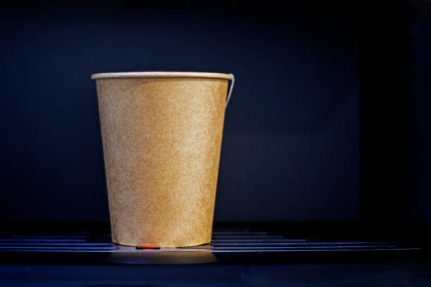 istock vending machine with a disposable, recyclable cardboard cup containing a hot drink. Ecology of the environment 2156221455