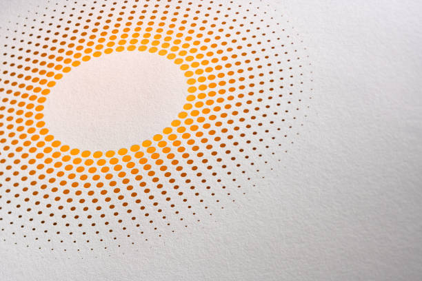 istock Abstract cut paper art featuring a circular pattern of yellow dots in a radial design on a light textured background. 2156221815