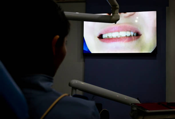 istock Young woman watching her dentist's assessment on the screen 2156224647
