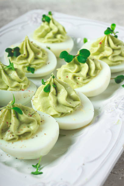 istock snack, stuffed eggs with avocado, homemade, no people, 2156225956