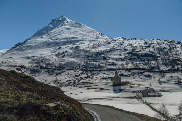 Spring hills and snow under Simplonpass with blue sky in sunny nice day