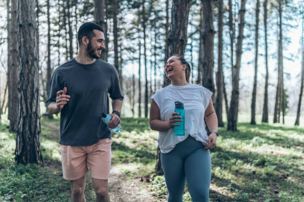 istock Couple jogging at the park 2156231514