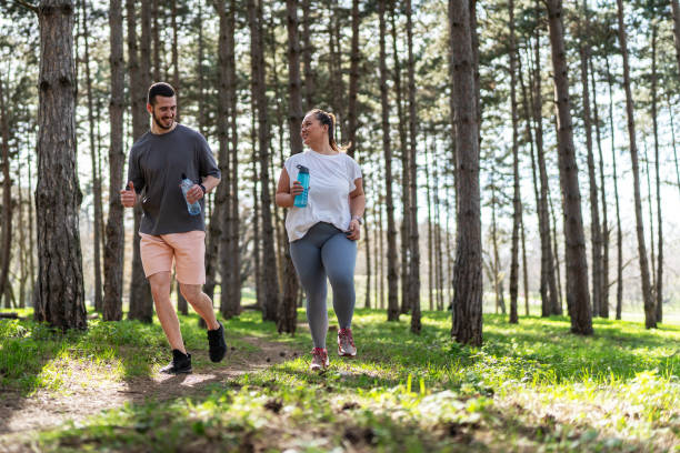 istock Couple jogging at the park 2156231541