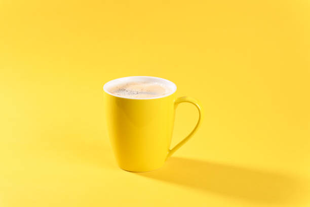 istock Cafe in yellow mug on yellow background. 2156231771
