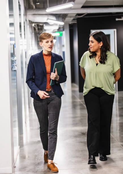 Manager showing new employee around office