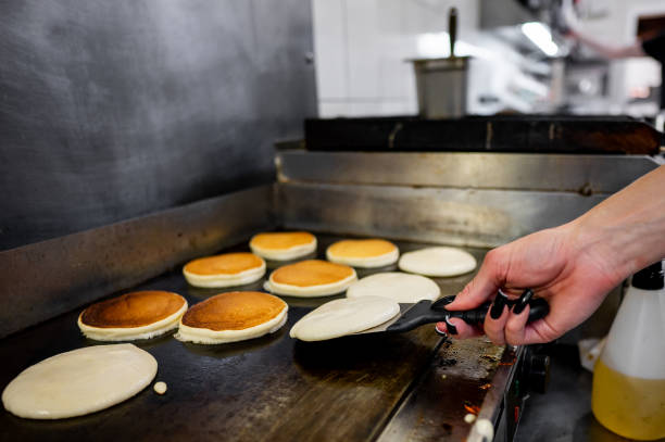 Flipping Pancakes at a breakfast fund raiser