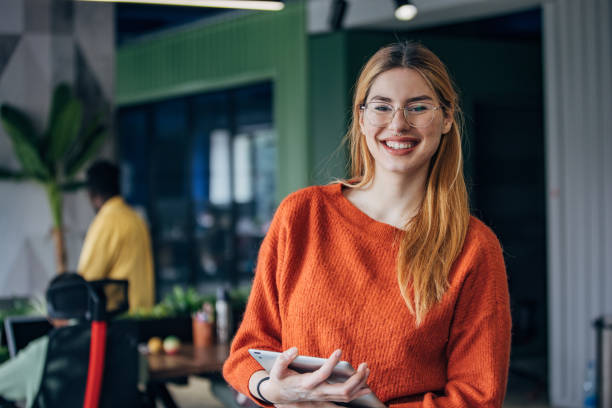 istock Beautiful young woman in office space 2156235319