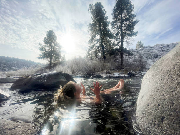 istock Woman cold plunging in winter river 2156235771