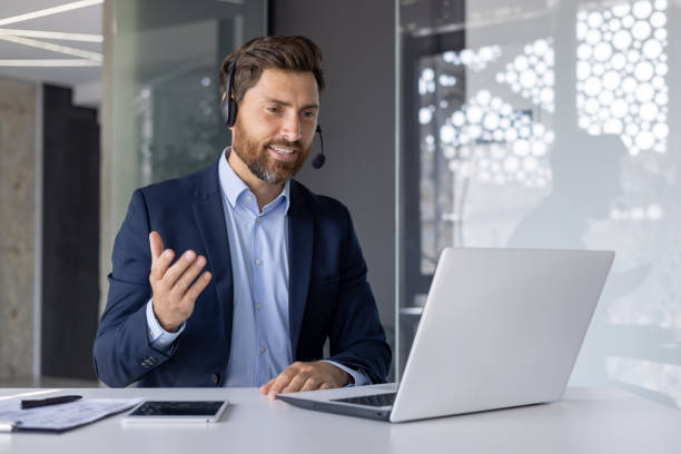 istock Confident businessman giving online presentation from office 2156239236