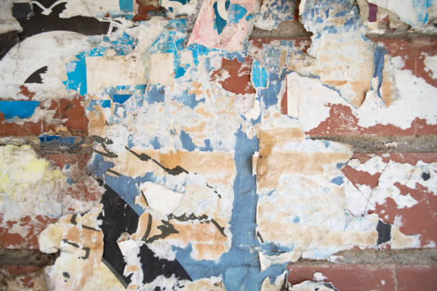 istock Torn and weathered street poster background, abstract paper collage backdrop 2156239385
