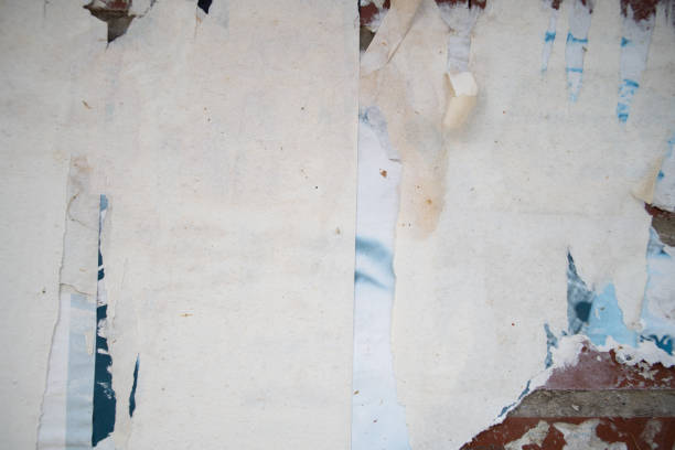 istock Torn and weathered street poster background, abstract paper collage backdrop 2156239406