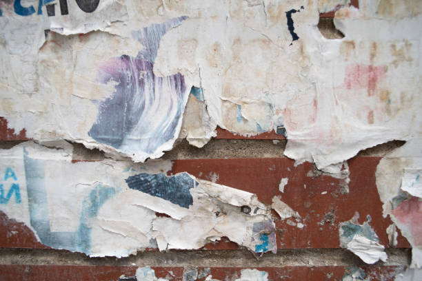 istock Torn and weathered street poster background, abstract paper collage backdrop 2156239422