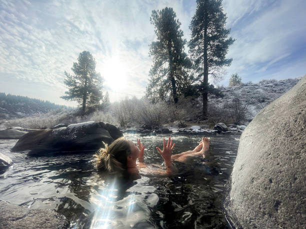 istock Woman cold plunging in winter river 2156239516