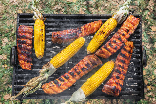 Preparing pork ribs on the barbecue grill in the backyard