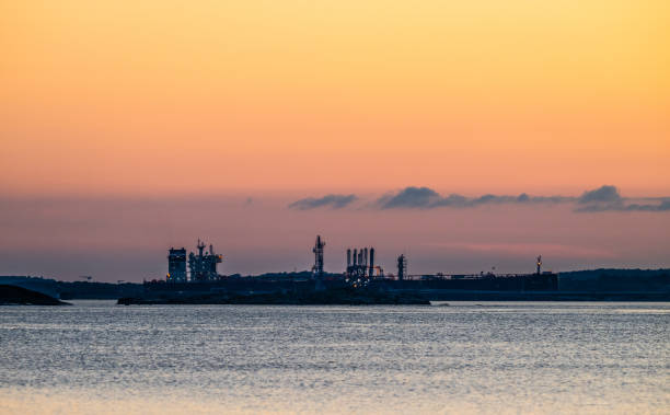 Large oil tanker unloading at an oil terminal.