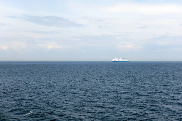 istock Seascape with a white ferry in the distance and waves. 2156244204