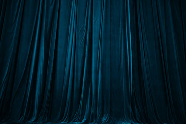 istock blue curtain in theatre background 2156244341