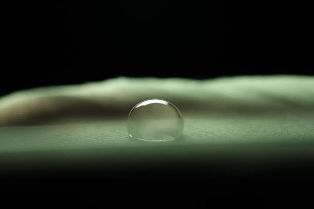 Colourful raindrop, abstract macro photo