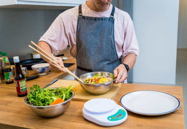 istock Chef at the kitchen preparing spicy glass noodle salad 2156245493