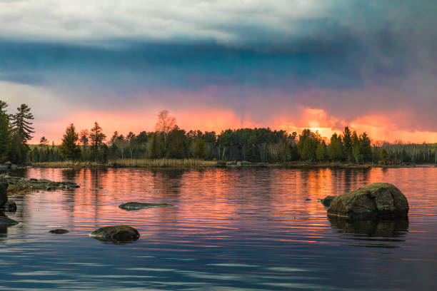 istock A storm front approaches over Boulder Lake near Duluth Minnesota as the sun sets in the distance on a beautiful spring evening 2156246829