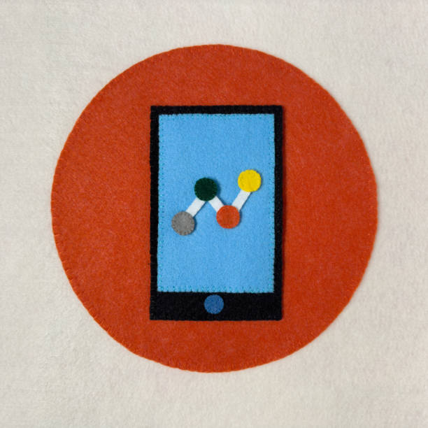 Smartphone with financial chart on screen over orange circle, hand made with felt texture. Business analysis on smartphone screen with charts. Digital analytics and online marketing data. Felt texture