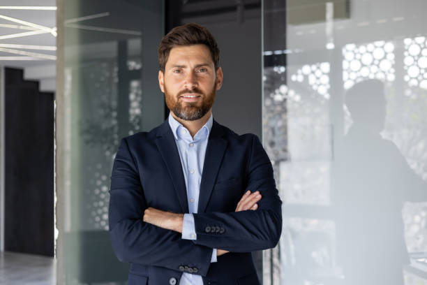 istock Confident businessman standing in modern office space 2156248565