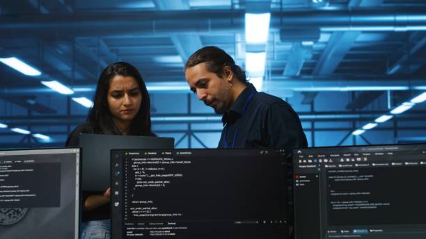 istock Admin in server hub using laptop to present manager plan of repairing equipment 2156251105