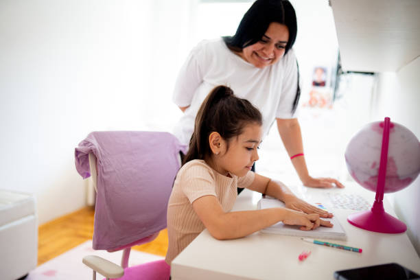 istock My mom is helping me with my homework 2156252068