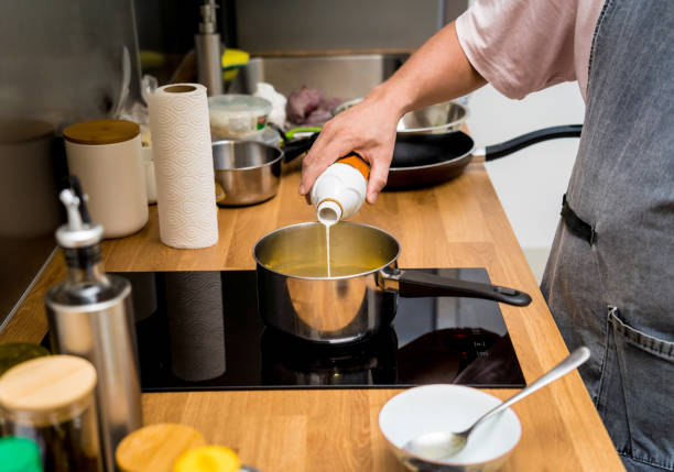 istock Chef at the kitchen preparing green curry with herbs and rice 2156253128