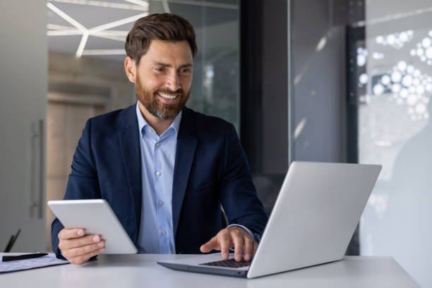 istock Professional business man working with laptop and tablet 2156255842