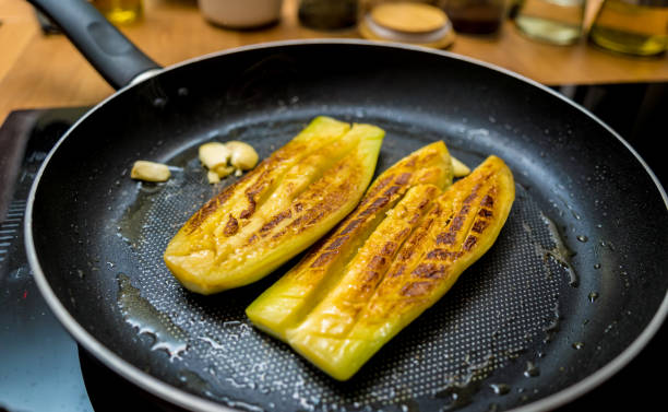 istock Delicious grilled eggplants with garlic on the fried pan 2156259732