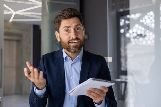 istock Confident business professional presenting ideas in modern office 2156259992