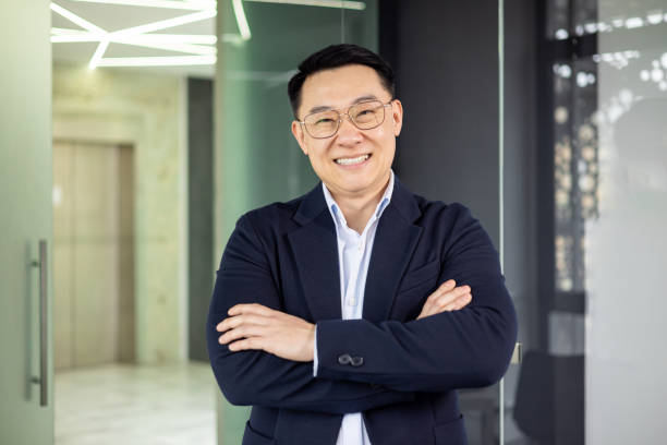 istock Confident businessman smiling in modern office setting 2156260943