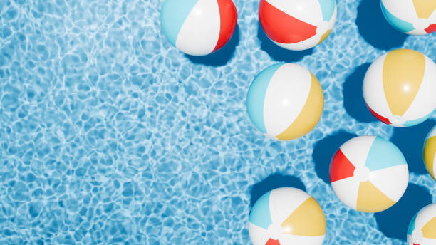 istock Summer holidays banner. Swimming pool top view. Beach ball in the empty clear pool. 2156261918