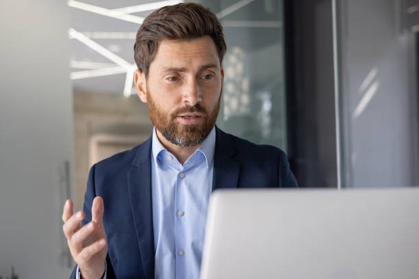 istock Businessman discussing work strategies over video call 2156262117