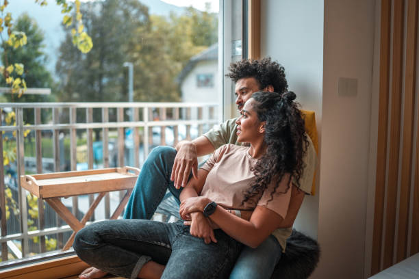 istock Stylish Multiracial Couple Enjoying Countryside Window View 2156263973