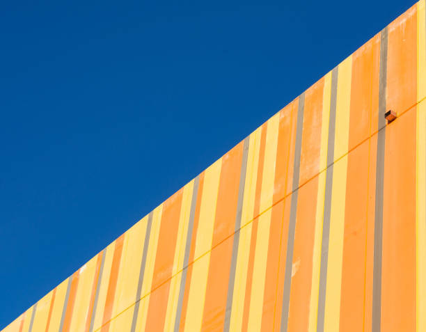 istock Yellow concrete building pattern against the blue sky 2156264710