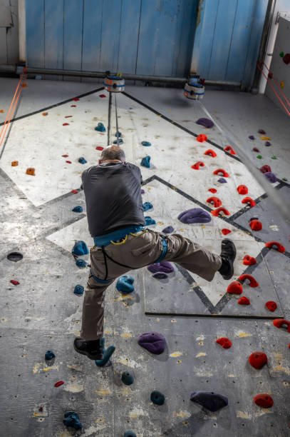 istock Mature man going down at indoor climbing 2156267935