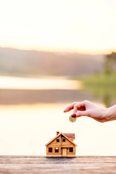 istock Real Estate Agent with house model and saving concepts 2156268404