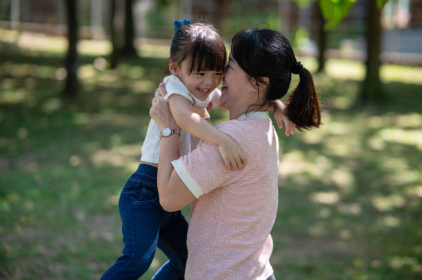 istock Cherished Times: Mother and Daughter's Park Adventure 2156269385