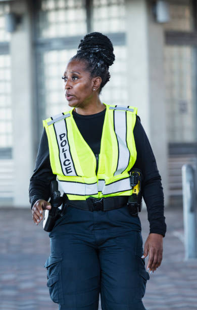 istock African-American policewoman in reflective vest 2156271886